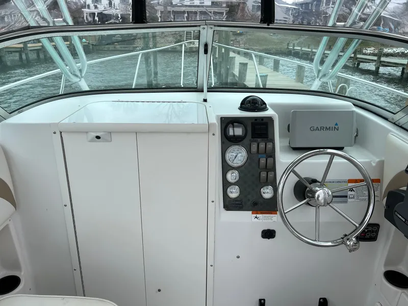Slide: The Image of 2003 Seaswirl Striper 2301 Walkaround OB boat dashboard with Garmin navigation system. - 7