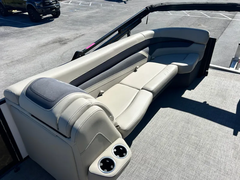 Slide: The Image of Luxurious seating on 2022 Barletta C24UC pontoon boat with cup holders. - 2