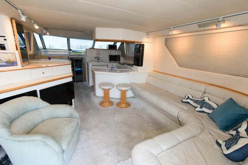 Slide: The Image of Luxurious interior of 1995 Sea Ray 500 Sedan Bridge yacht with plush seating and modern amenities. - 15