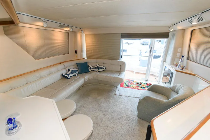 Slide: The Image of Luxurious interior of 1995 Sea Ray 500 Sedan Bridge yacht with plush seating. - 16