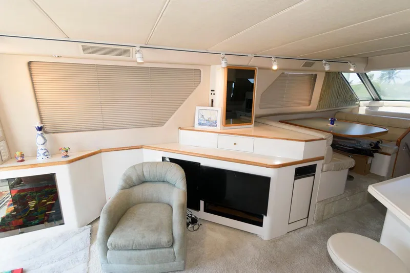 Slide: The Image of Interior of 1995 Sea Ray 500 Sedan Bridge yacht, featuring plush seating and modern amenities. - 20