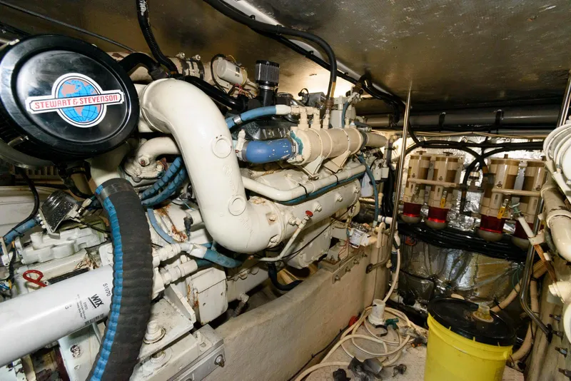 Slide: The Image of Engine room of a 1995 Sea Ray 500 Sedan Bridge yacht, showcasing mechanical components. - 29