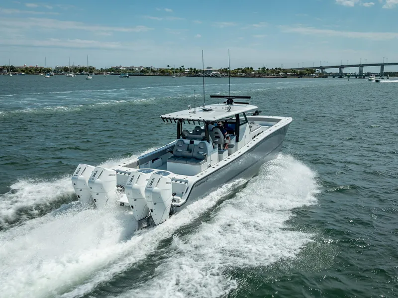 Slide: The Image of 2024 Freeman 43 boat cruising on open water with twin engines. - 13