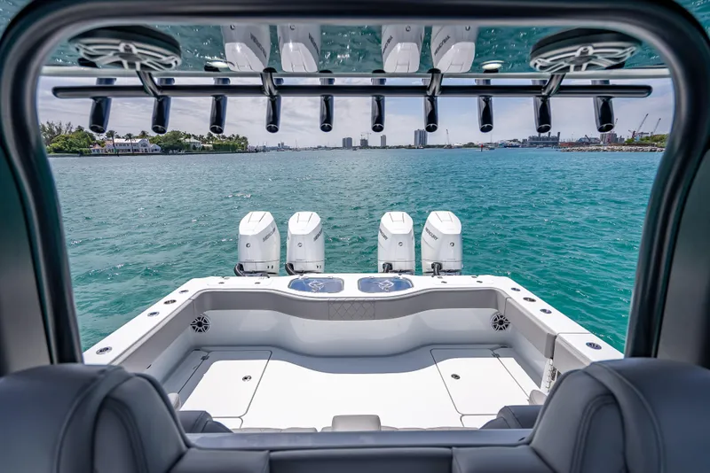 Slide: The Image of 2024 Freeman 43 boat with four engines on open water. - 16