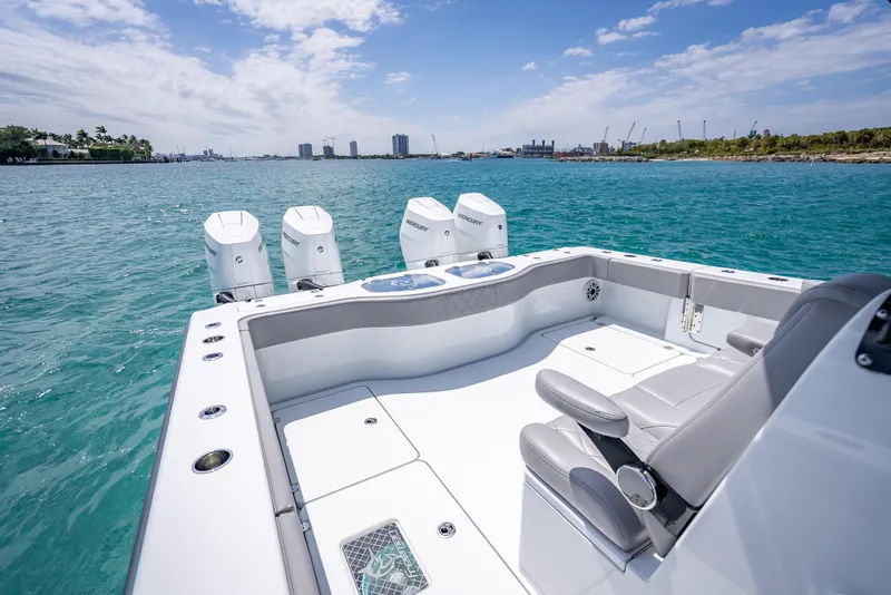 Slide: The Image of 2024 Freeman 43 boat with four engines on a sunny day at sea. - 18