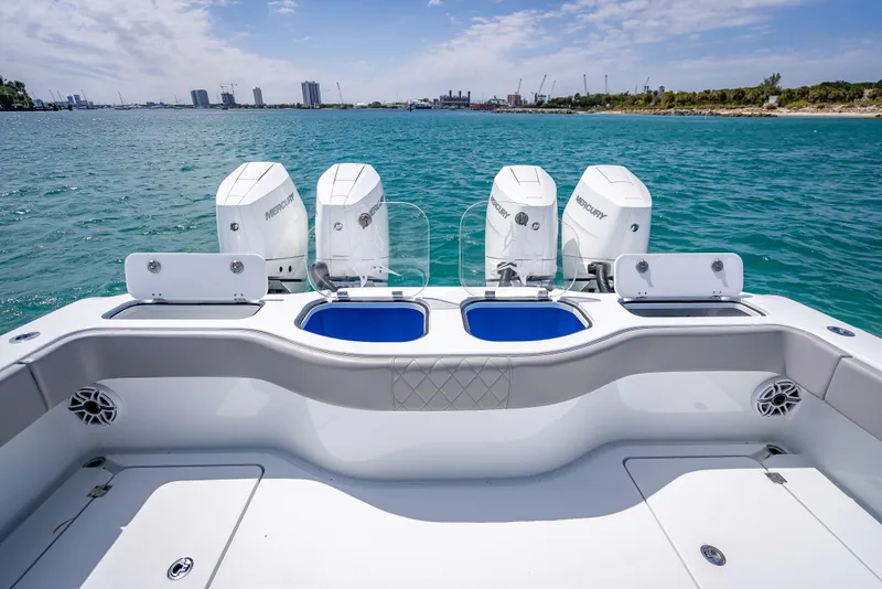 Slide: The Image of 2024 Freeman 43 boat with four powerful engines on a clear blue sea. - 20