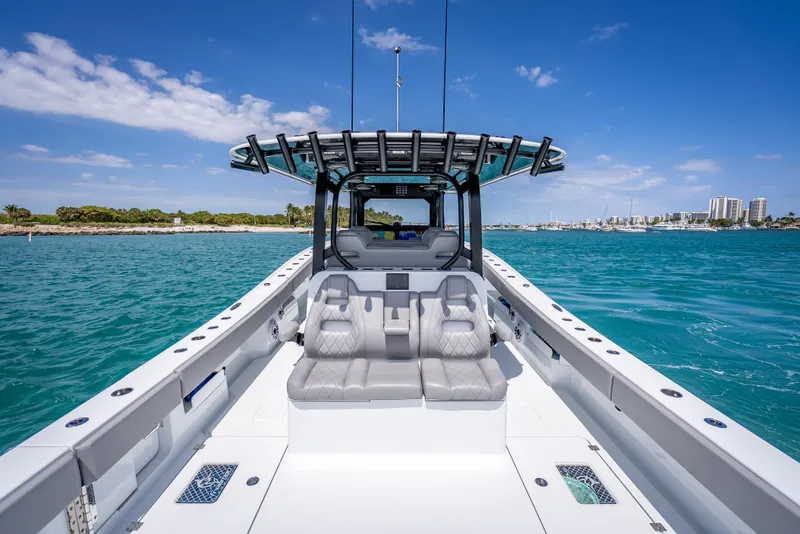 Slide: The Image of 2024 Freeman 43 boat on clear blue water under a sunny sky. - 21