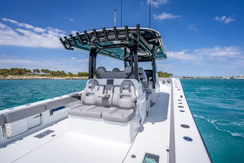 Slide: The Image of 2024 Freeman 43 boat on clear blue water under a sunny sky. - 22