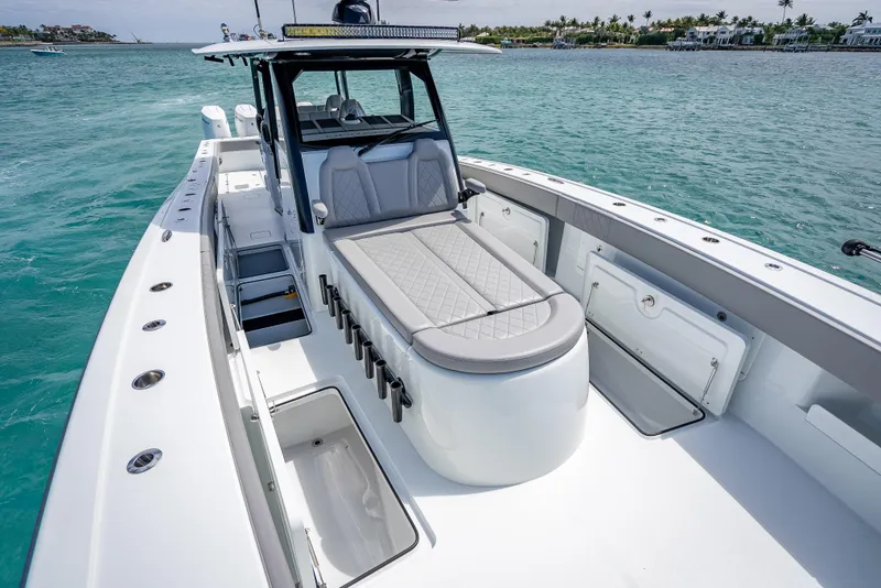 Slide: The Image of 2024 Freeman 43 boat with sleek design on clear blue water. - 34