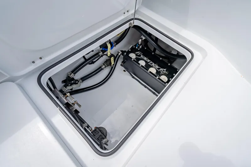 Slide: The Image of Freeman 43 (2024) boat compartment with visible wiring and components. - 46