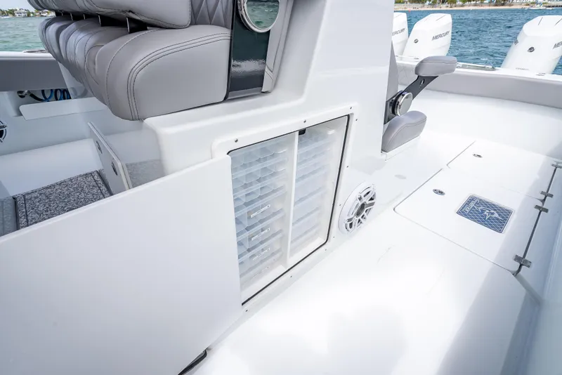 Slide: The Image of 2024 Freeman 43 boat interior with seating, storage, and speaker on deck. - 49