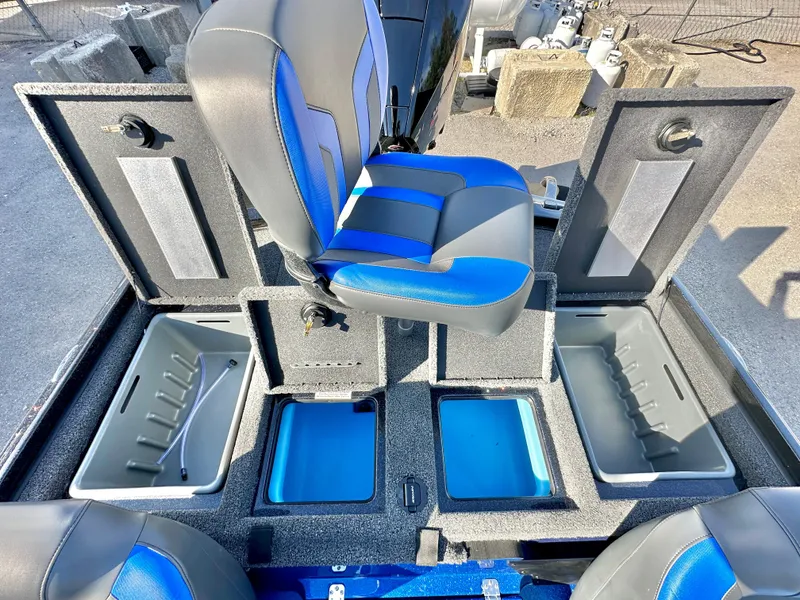 Slide: The Image of 2025 Nitro Z19 boat storage compartment with blue interior and organized layout. - 16
