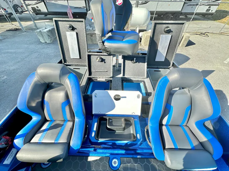 Slide: The Image of 2025 Nitro Z19 boat storage compartment with open lid, showcasing interior layout and equipment. - 17