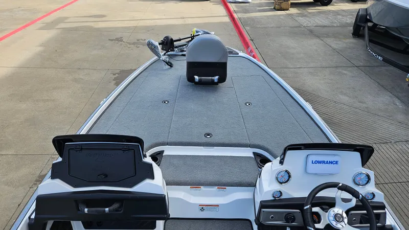 Slide: The Image of 2025 Nitro Z20 XL boat interior with steering wheel and navigation system. - 2