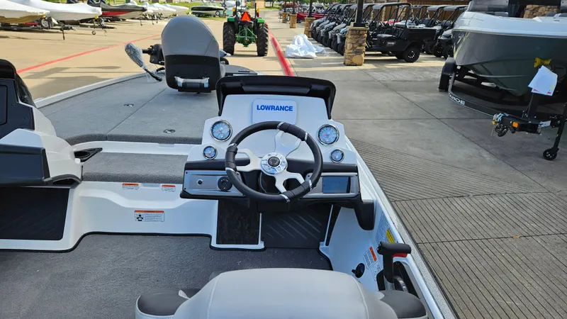 Slide: The Image of 2025 Nitro Z20 XL boat dashboard with steering wheel and Lowrance electronics. - 3