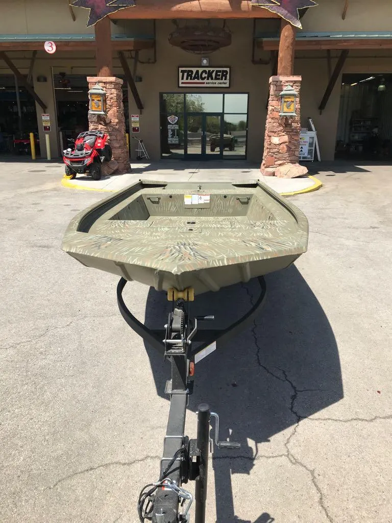 Slide: The Image of 2025 Tracker Grizzly 1754 Jon boat displayed outside a dealership. - 6