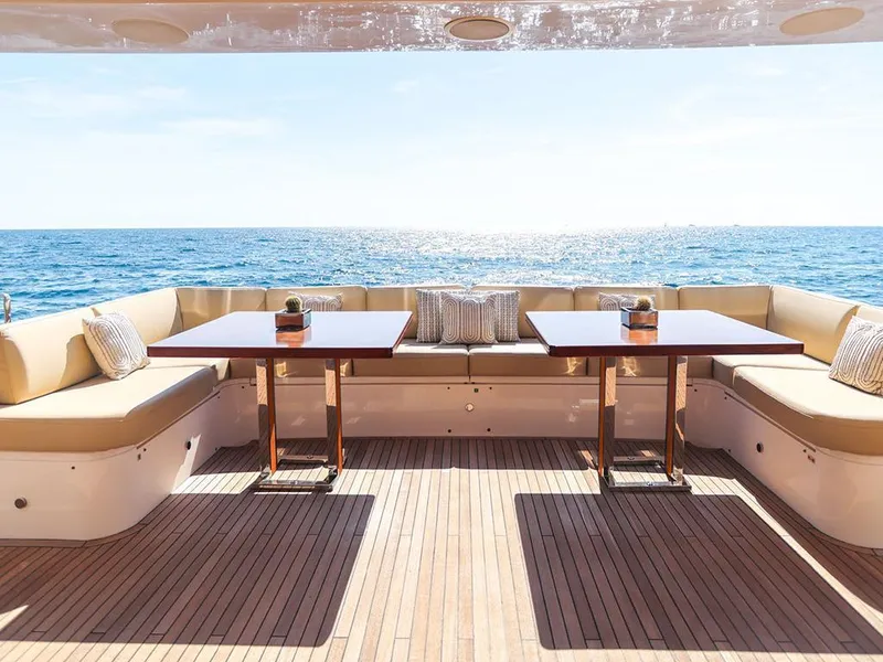 Slide: The Image of Luxurious yacht deck with seating, tables, and ocean view, 33rd Strike Group model1123, 2026. - 9