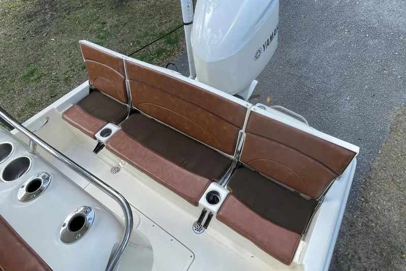 Slide: The Image of 2015 Scout 251 XS boat with brown seating and Yamaha engine. - 15