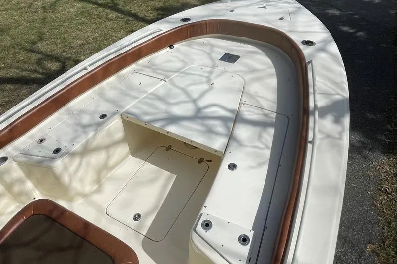 Slide: The Image of 2015 Scout 251 XS boat deck with seating and storage compartments. - 19