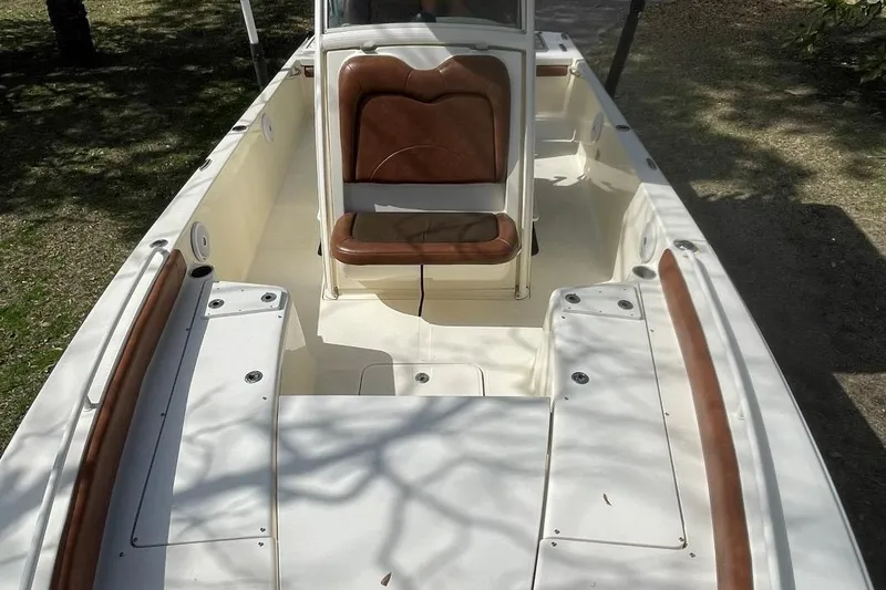 Slide: The Image of 2015 Scout 251 XS boat interior with seating and storage compartments. - 20