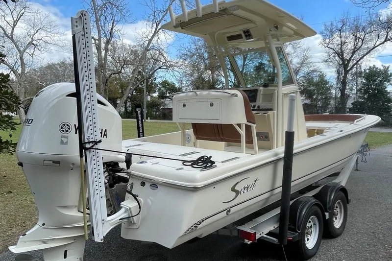 Slide: The Image of 2015 Scout 251 XS boat on trailer with Yamaha engine, parked outdoors. - 3