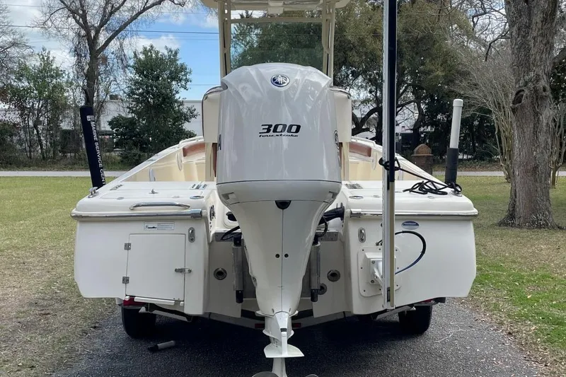 Slide: The Image of 2015 Scout 251 XS boat with 300 horsepower engine, parked outdoors. - 6