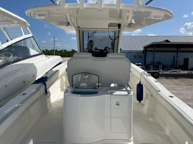 Slide: The Image of 2025 World Cat 280 CC-X boat interior with seating and helm station. - 7