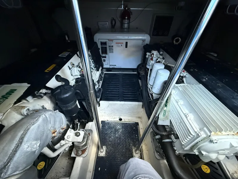 Slide: The Image of Engine room of 2008 Luhrs 35 Convertible boat, featuring dual engines and generator. - 20