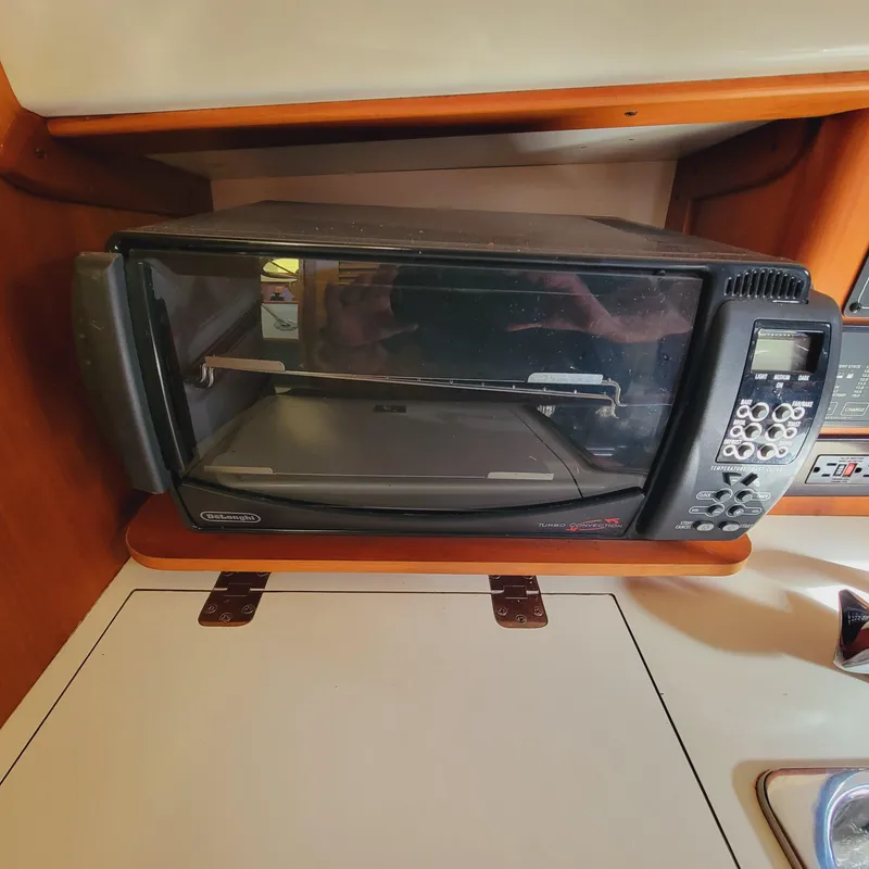 Slide: The Image of Toaster oven in 1999 Hinckley Picnic Boat Classic kitchen area. - 16