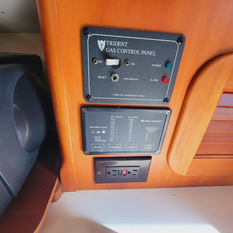 Slide: The Image of Control panel on 1999 Hinckley Picnic Boat Classic, featuring Trident gas and electrical systems. - 17