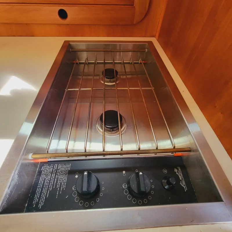 Slide: The Image of Stainless steel stove in 1999 Hinckley Picnic Boat Classic galley. - 19