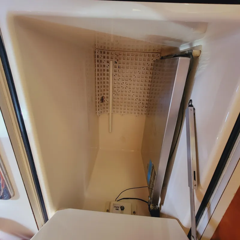 Slide: The Image of Interior view of a 1999 Hinckley Picnic Boat Classic storage compartment. - 24