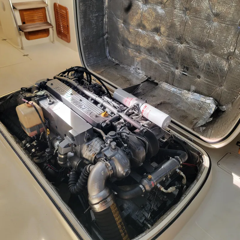 Slide: The Image of Engine compartment of a 1999 Hinckley Picnic Boat Classic, showcasing detailed mechanical components. - 26