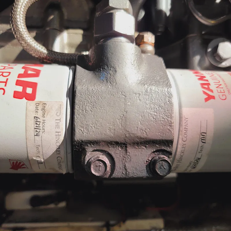 Slide: The Image of Close-up of a 1999 Hinckley Picnic Boat Classic engine component with Yanmar filter. - 28
