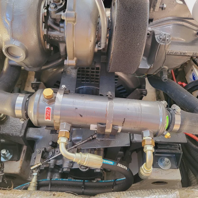 Slide: The Image of Engine components of a 1999 Hinckley Picnic Boat Classic, showcasing mechanical details and connections. - 29