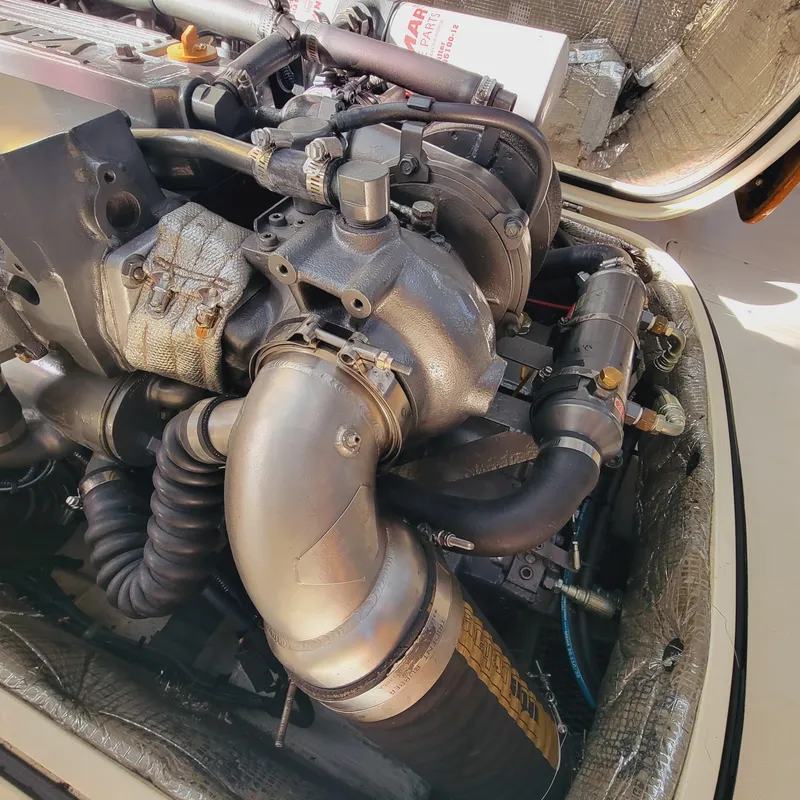 Slide: The Image of Engine of a 1999 Hinckley Picnic Boat Classic, showcasing intricate mechanical components. - 30