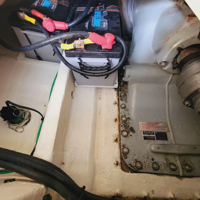 Slide: The Image of 1999 Hinckley Picnic Boat Classic engine compartment with batteries and wiring. - 35