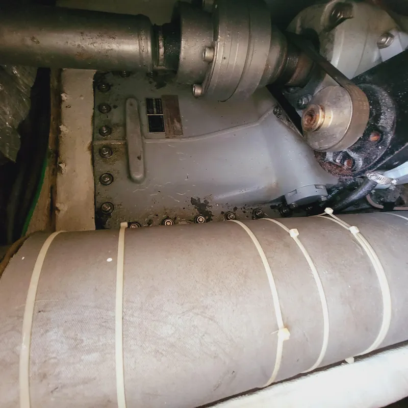 Slide: The Image of Engine compartment of a 1999 Hinckley Picnic Boat Classic, showing mechanical components. - 36