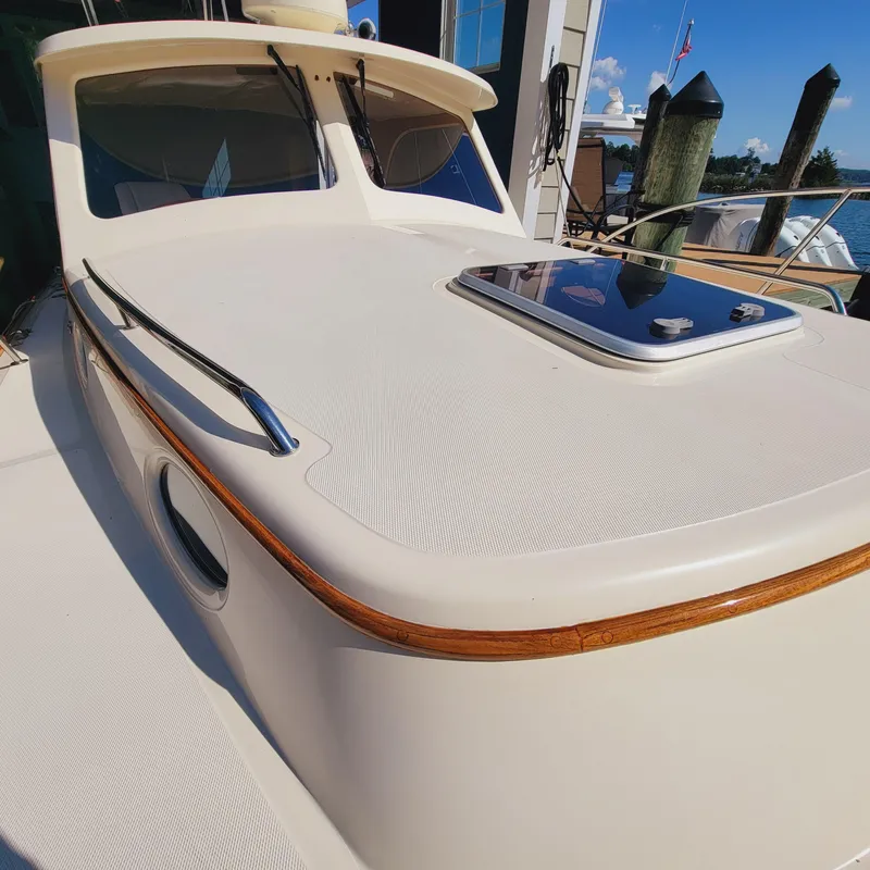 Slide: The Image of 1999 Hinckley Picnic Boat Classic with sleek deck and polished wood accents. - 40