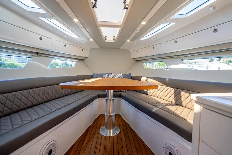 Slide: The Image of Luxurious interior of 2023 Intrepid 41 Valor yacht with elegant seating and wooden table. - 39