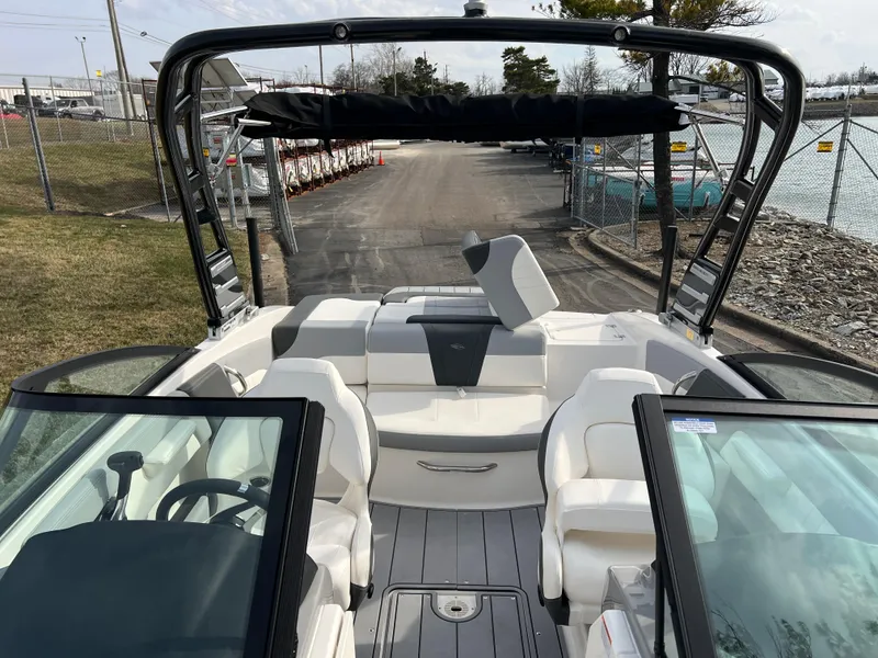 Slide: The Image of 2025 Chaparral 21 SSi boat interior with seating and open deck view. - 14