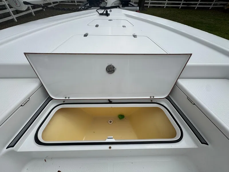 Slide: The Image of Open storage compartment on 2011 BlackJack 224 boat deck. - 26