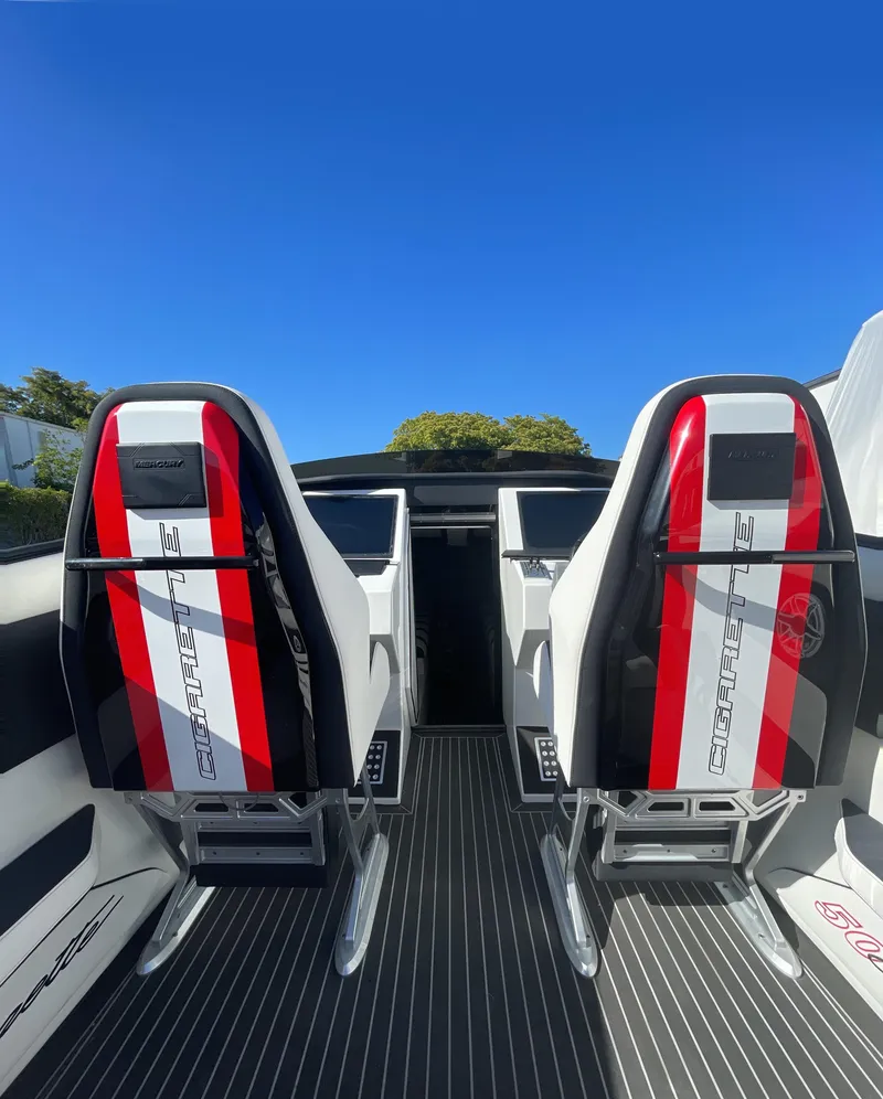 Slide: The Image of 2013 Cigarette 50' Marauder boat interior with red and black racing seats. - 3