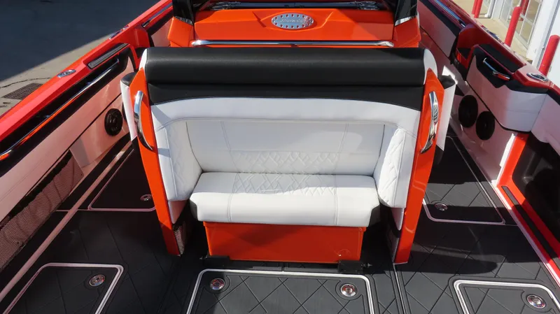 Slide: The Image of 2023 Nor-Tech 450 boat interior with red and black seating and modern design. - 14