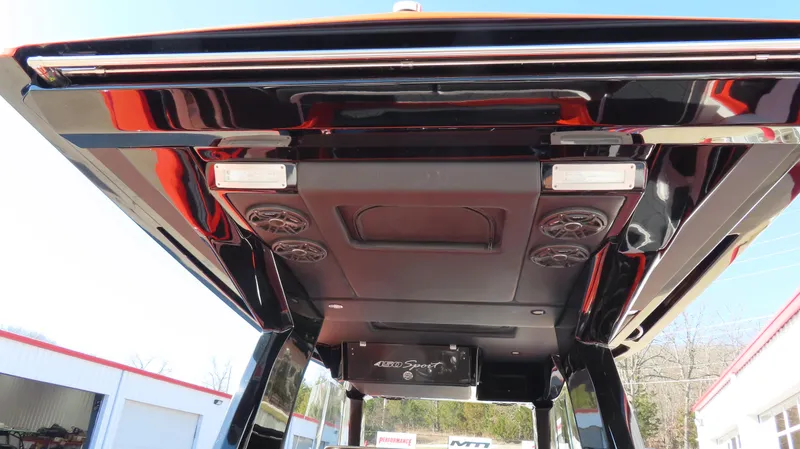 Slide: The Image of 2023 Nor-Tech 450 boat roof with speakers and lights, showcasing sleek design. - 18