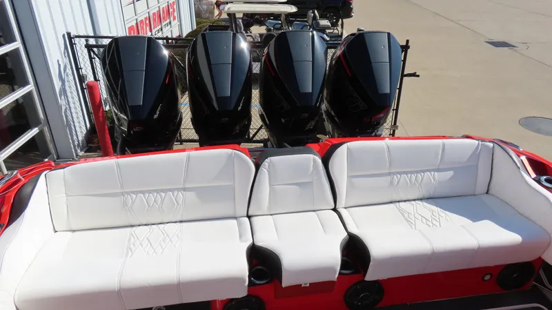 Slide: The Image of 2023 Nor-Tech 450 boat with four powerful outboard engines and luxurious white seating. - 21