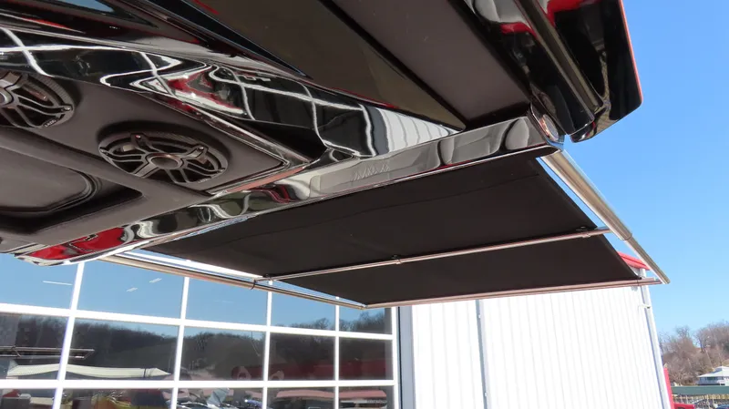 Slide: The Image of 2023 Nor-Tech 450 boat with sleek design and modern features, showcasing speakers and sunshade. - 29