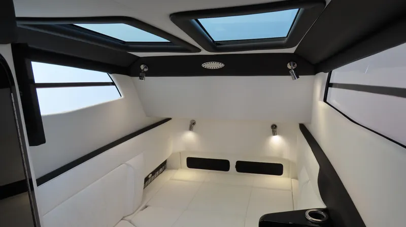 Slide: The Image of Interior of 2023 Nor-Tech 450 boat, featuring modern design with skylights and ambient lighting. - 30