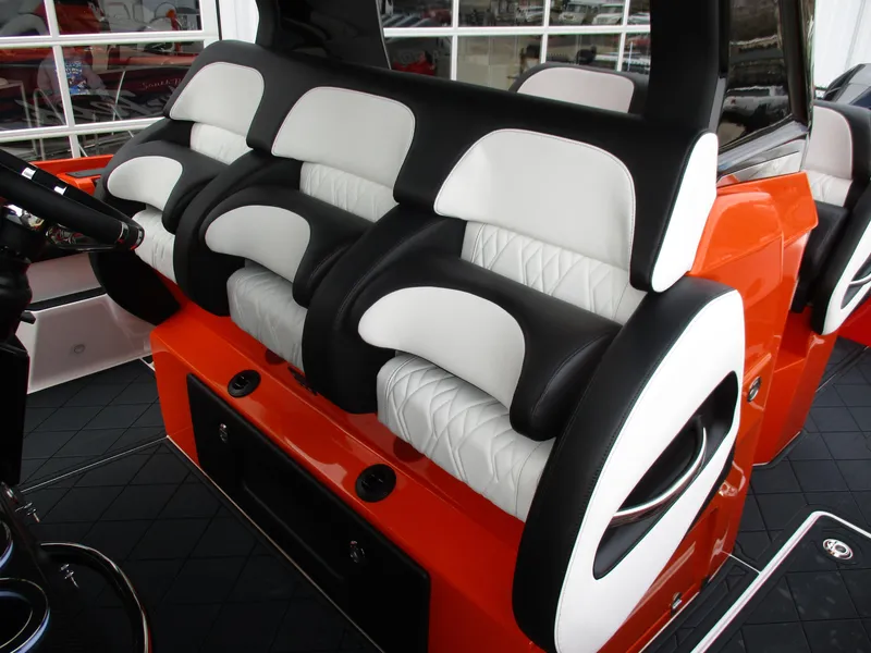 Slide: The Image of 2023 Nor-Tech 450 boat interior with luxurious black and white seating. - 40