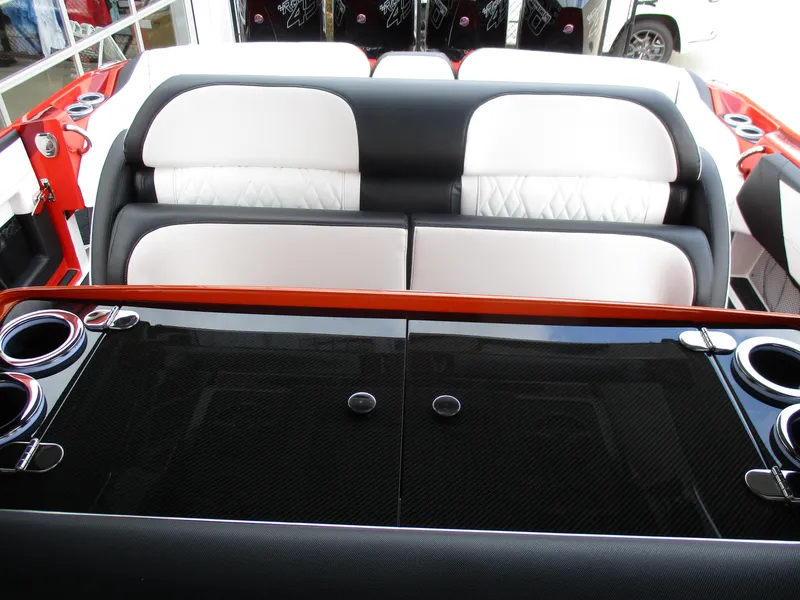 Slide: The Image of Luxury seating in 2023 Nor-Tech 450 boat with sleek black and white upholstery. - 43